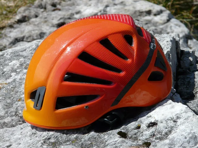 climbing helmet, helmet, sport climbing helmet, protection, security, rockfall, protected, climbing equipment, equipment, orange, gaudy, brightly colored, coloured, colorful, bright, signal color, noticeable, climbing helmet, climbing helmet, climbing helmet, climbing helmet, climbing helmet. Buying arborist equipment in Canada vs the United States, and what duty adds